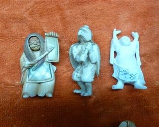 Three carved ivory figures, the one on left with rotating head @ $84, the one with turtle head @ $64, the standing buddha now reduced to $24