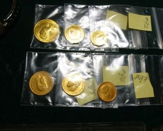 Set of three graduated Thai gold coins and three Russian Czar Nicholas gold coins