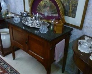 Antique wash stand with two metal towel racks on sides, black marble top, @ $150