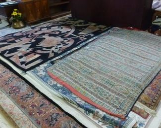 One of three piles of rugs we have for you to inspect.