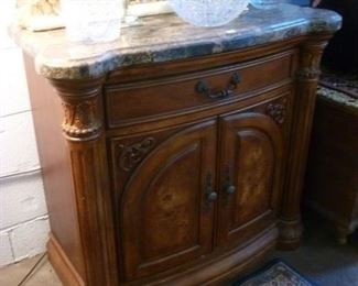 One of a pair of marble-top cabinets reduced from $254  to $200 each or $300 for the pair