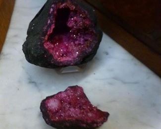 Geode found in Morocco, split open, artificial deep purple color added, on plastic stand @ $10