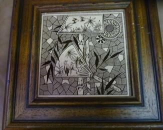 One of three remaining brown or black-on-white ceramic tiles in Art Deco style, this one with an Asian motif, framed, @ $36 each