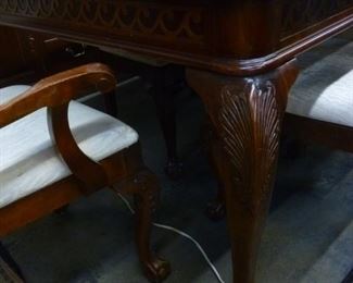 Notice the carving on the legs of this dining table, now reduced to $200