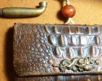 Notice the repousse metal dragon, similar to a menoke woven into a sword handle.