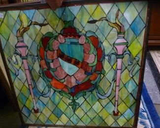 Stained glass panel made by putting colored glass against a clear pane -- no leading in between the colored pieces, offered @ $125.