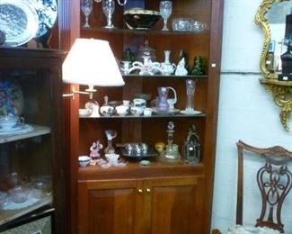 Solid cherry corner cabinet with open glass shelves over 2 cupboard doors with brass knobs, offered at $200