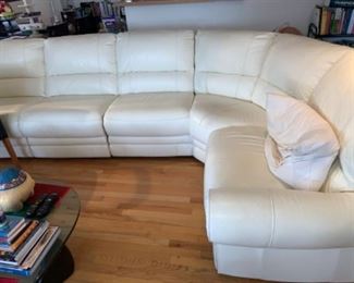 Sectional off white color leather has electrical hardware