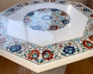 This marble table is not on location at 600 S Dearborn. Please, make an appointment to see or you can purchase it through our marketplace sale on-line named "While in lock down Still' or call 312-203-0342 Irena