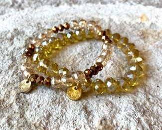 Costume Jewelry. Pair of Champaign  and gold color beaded bracelets. $10/pair. 