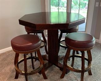 Country club style pub table with 4 round stools. Classic warm mahogany color. Solid wood. Normal wear on the top. 42” W x 42” H. $550