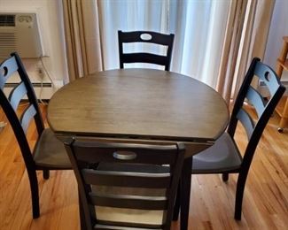 Ashley Kitchenette Table and 4 chairs (40 " round 30" high, with 2 side drop leaves)
