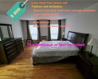 PRICE REDUCED for a quick sale.  7- piece mahogany color Queen size bedroom set: 1 Queen size bed with 2 drawers (mattress not included); 2 nightstands; 2 table lamps; 1 8-drawer dresser; 1 mirror.