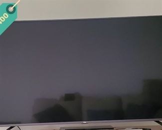 TCL 65-inch 4K UHD TV  with box and Roku voice control remote, with original box. Less than two years old.