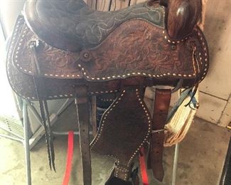 Well, this vintage Western saddle is still here. What house is complete without a vintage Western saddle?