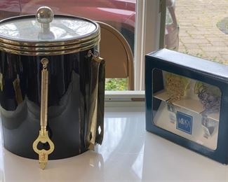 Lot 4.  $14.00 Mikasa set of two wine bottle stoppers, in original box, and black ice bucket with tongs and bottle opener, acrylic top,  used condition.