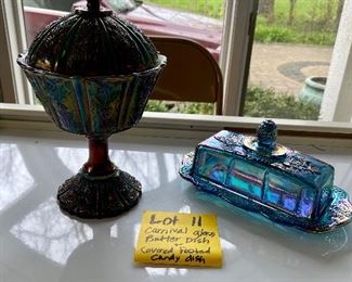 Lot 11   $14.00 Fenton Carnival Glass Covered Footed Candy Jar 9” H x 5.25” D and Carnival Glass Butter Dish “Indiana Glass ?”  The Fenton piece looks very dark here, but in actuality it's quite lovely.