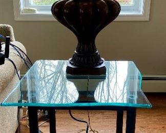 Lot 29.  $90 for the Pair of Glass Occasional Side Tables, with 3/4" Thick Glass, sculpted on sides,  25” W X 25” with Black 4 leg metal base 23.5” H. Heavy