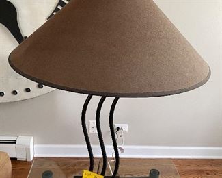 Lot 30.  $35.    28” tall lamp with black metal base and light brown shade
