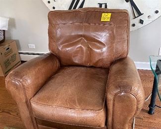 Lot 31.  $75. Well-distressed leather patina Recliner very comfy, squishy and solid.  Perfect for your casual hangout room! 