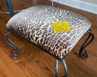 Lot 32   $45.  Wrought iron footstool, covered with leopard velvety fabric.  Go ahead, put your feet up - You deserve it.  