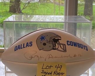 Lot 49.  $125 Famed Roger Staubach signed Dallas Cowboys Football in Plexiglas display case.  A Legend!
