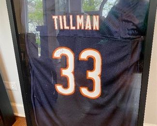 Lot 51.  $125    Chicago Bears Charles “Peanut” Tillman signed jersey no. 33.  in heavy-duty black shadow frame.  (we paid $100 for this kind of frame like this to mount a Michael Jordan jersey; these frames are expensive)
