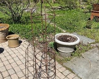 Lot 66.  $50.   Two vintage garden obelisks.  The tall one is 63" high, wrought iron and perfect for climbing rose bushes, trumpet vines, clematis or any other climbing flower or plant.  The smaller one stands 37" and is some sort of coated metal.  Give your garden some character, and buy this now!  