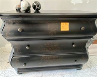 Lot 84.   $225.  Good looking Bombe chest, in a black stain, decorated.  Chest measures  39.5Wx18.75Dx34H, Unbranded.  Top drawer a tad hard to open - should not be hard to  figure out.