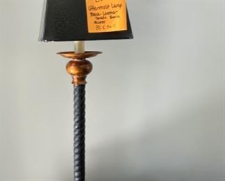 Lot 85.  $48. Really stylish console lamp leather shade and black and bronze/copper base. 31.5 inches tall. From Uttermost.