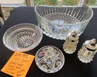 Lot 92.  $12.00.  Set of 4 plus a little bonus. Set includes Clear Glass Salad bowl made in France, finger bowl,  glass coaster and an interesting salt & pepper shakers.  Bonus:  crystal little Teddy Bear holding a heart.  