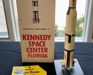 Lot 93. $45   Apollo  Saturn V Rocket Model, 13.5" with original box, and Apollo XV Lunar Rover Plaque from the Kennedy Space Center.   This is a neat item!