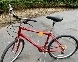 Lot 115  $95. Trek Navigator 200 Boys bike. Needs new tube for rear tire.  Shimano components .  18.5 (47 cm) bike frame in red.  Light wear & tear from average use.  From their specs:  V-Brakes, Alloy Suspension Seatpost, Saddle Cloud 9 padded w/springs, Rims:  Alloy 26" 