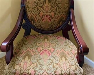 Lot 123  $125.   Victorian Reproduction with a modern twist.  Tapestry Upholstered fabulous Arm Chair with carved detail.  Seat measures 30 x 27, 17 in. high, 42 in. deep.  colors are Olive, coral, tan and is in great shape