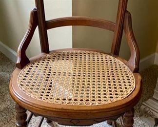 Lot 125.  $55. Antique Cane Seat Chair.  Cane is in great shape, as is the entire ladder back chair.