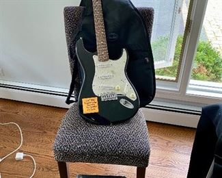 Lot 54  $150.00  Yes still available. Fender Stratacaster Squier Electric Guitar with case and Squier SP-10 Amplifier 
