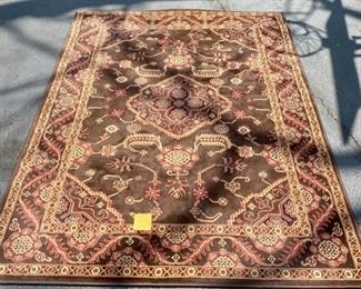 Lot 134. $195. Area Rug. Emily Triumph. Brown, Red and Cream.  5'2" by 7'2". Not wool, but would be a great durable rug for an office! Needs a good cleaning.   
