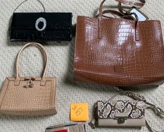 Lot 157.  $25. Lot of Reptile skinned purses, that works, right! 
