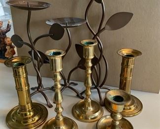 Lot 167.  $40.  Includes 5 brass candlestick (so vintage cool) and 3 leaf motif candlesticks. 