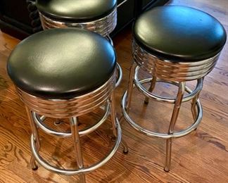 Lot 208 $120.00 Trio of 50's style "diner" bar stools with black vinyl seat and chrome bases.  Minor rip on two of the stools as shown in photos.