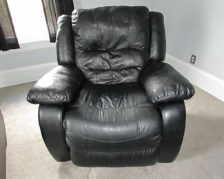 (2 available but priced separately). "Flair Enterprises" faux leather recliner. (wear to faux leather). 41"w X 40"h X 39"d. PRICE: $40.00 (less wear to this recliner)