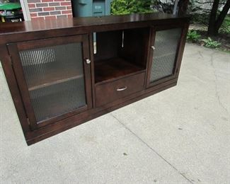 Contemporary media console with glass doors. 66"w X 30"h X 18"d. Light wear as seen in pictures. PRICE: $125.00