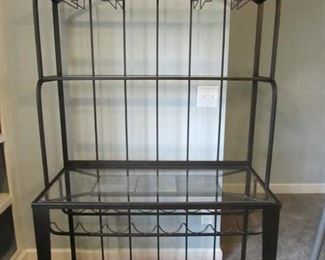 Metal baker's rack with glass and tile inserts and wine bottle and glass storage. 41.5"w X 19"d X 76"h. PRICE: $250.00