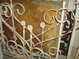 This iron fence piece has a matching gate