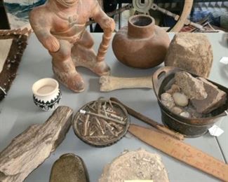 #24 $55 - Fossils, Native American Pottery, and Antique Nails. ONLY items on the table are included except for the partial picture of the rug on the table, that is not included  