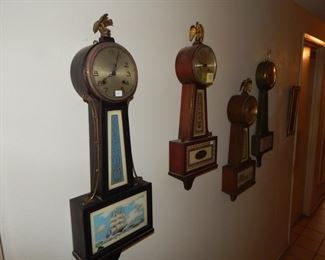 #13 $100 - Lot of (4) Banjo Clocks - Seth Thomas Ship, Seth Thomas, Carriage, and Gilbert Floral
