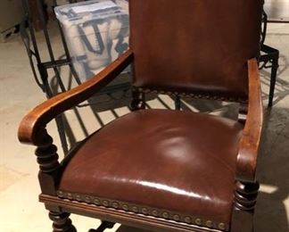 139. Pair of Leather Arm Chairs w/ Carved Wood Base w/ Nailhead Detail (23'' x 24'' x 44''),  $ 550.00 