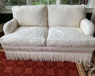 57. Upholstered Cream 2 Cushion Loveseat w/ Bouillon Fringe (37'' x 37'' x 34''), $ 1,200.00