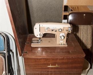 F28	Remington Deluxe Super Zig Zag Sewing Machine and Cabinet	$199.95