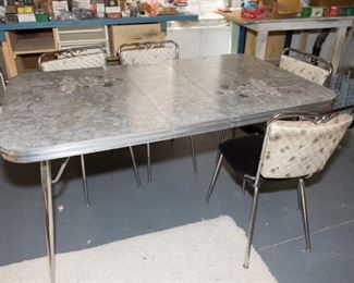 F29	Laminate and Chrome Retro Kitchen Table with 4 Vinyl Chairs (Chairs have some upholstery rips)  60”w x 36”d x 30”h  Seats 17”H x 16”w x 15”D	$249.95